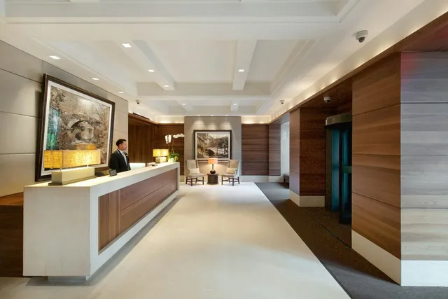 a bathroom with a tub sink toilet and mirror