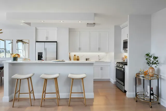 a kitchen with a sink and a refrigerator