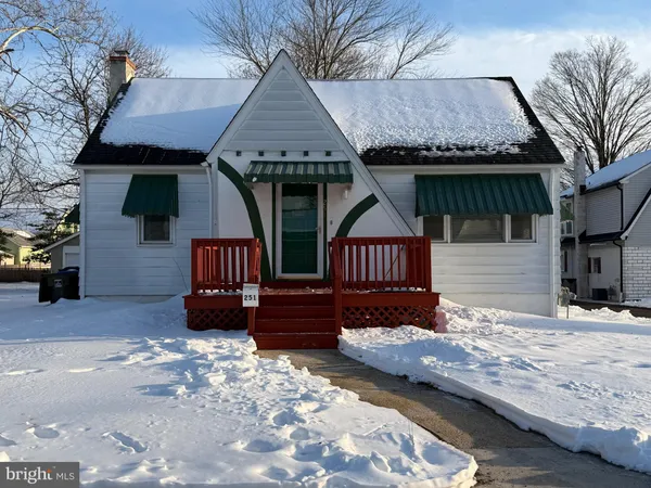 front view of a house with wooden fence