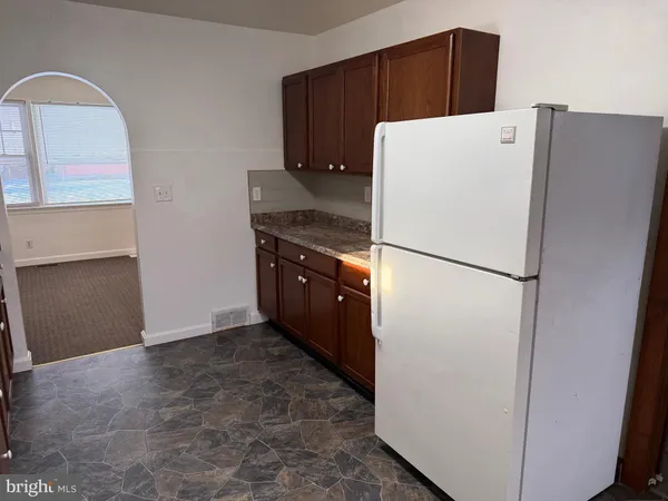 a kitchen that has a sink and a stove
