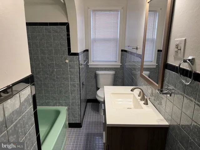 a bathroom with a large mirror
