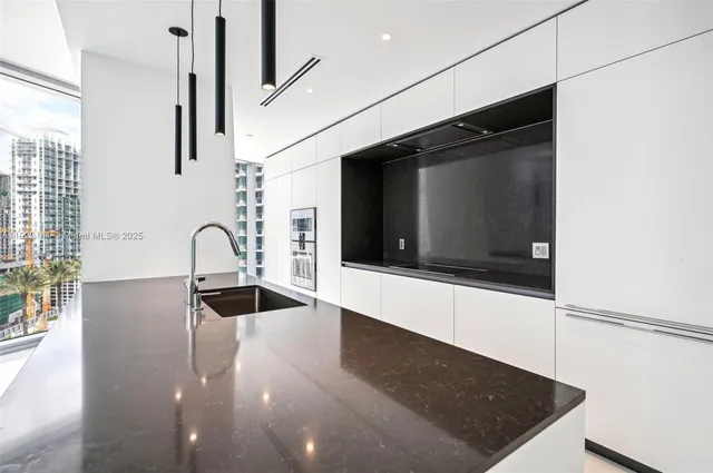 a view of livingroom with washer and dryer