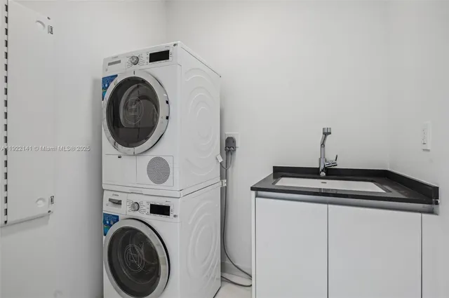 a bathroom with a double vanity sink toilet and shower
