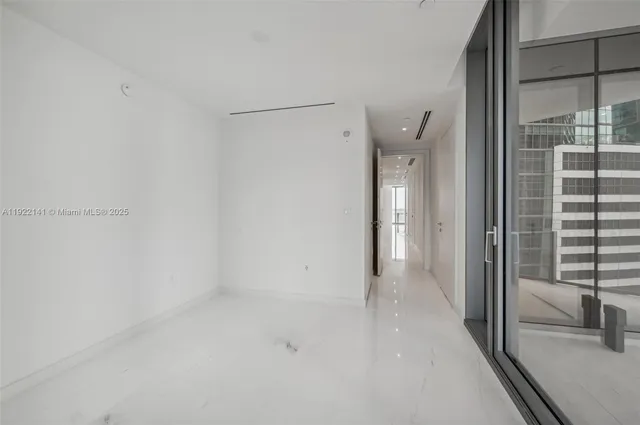 a bathroom with a sink a mirror and a shower