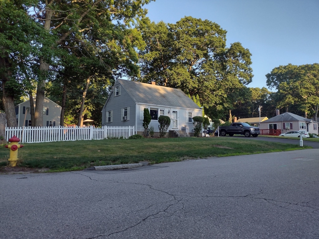 4 Fuller Road Attleboro, MA 02703 - Photo 1 of 16 a front view of a house with a garden and trees
