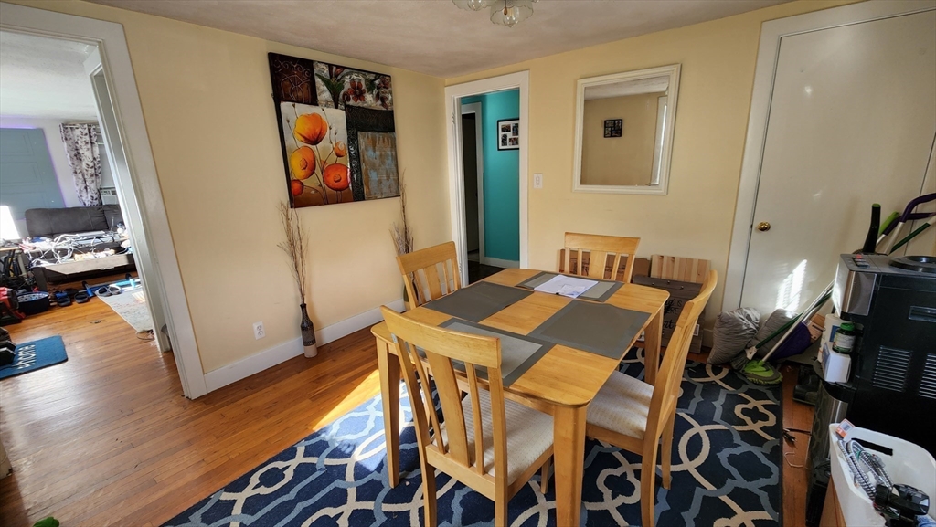 4 Fuller Road Attleboro, MA 02703 - Photo 4 of 16 a bedroom with a bed and a table in it