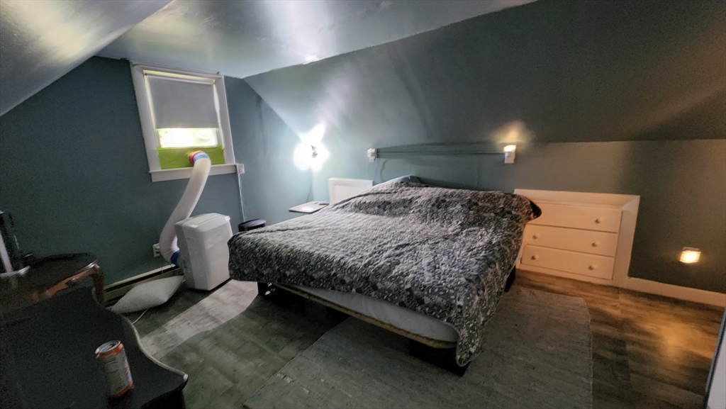 4 Fuller Road Attleboro, MA 02703 - Photo 8 of 16 a bedroom with a bed and a lamp