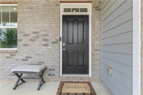 a brick house with table and chairs