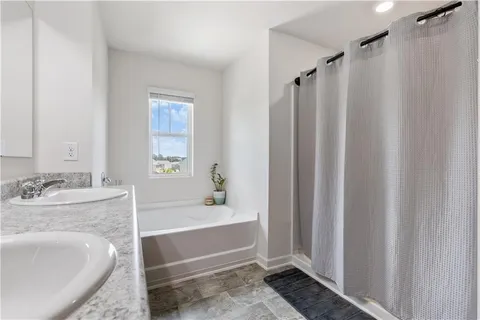a bathroom with a sink and a bathtub