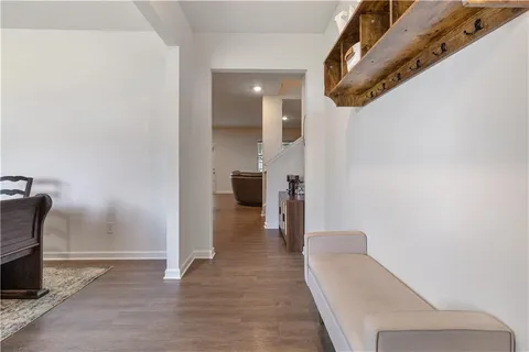 a view of a hallway with seating space