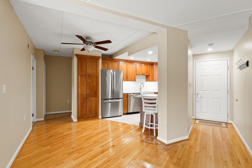 155 George Washington Boulevard, Unit 210 Hull, MA 02045 - Photo 12 of 42 a view of empty room with wooden floor