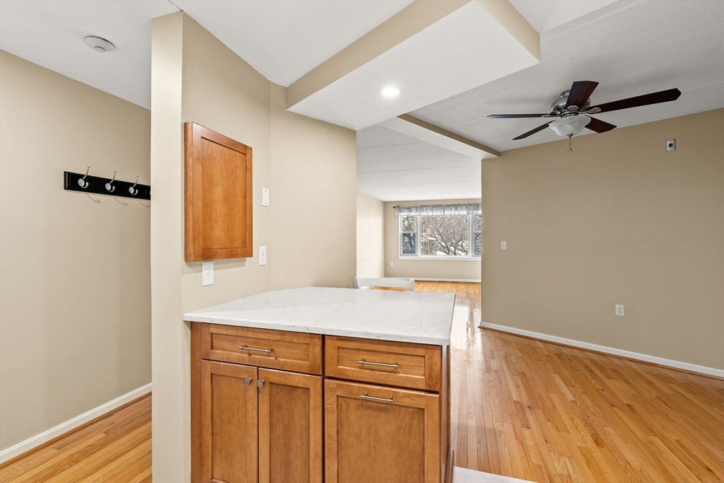 155 George Washington Boulevard, Unit 210 Hull, MA 02045 - Photo 13 of 42 a hallway with a wooden floor