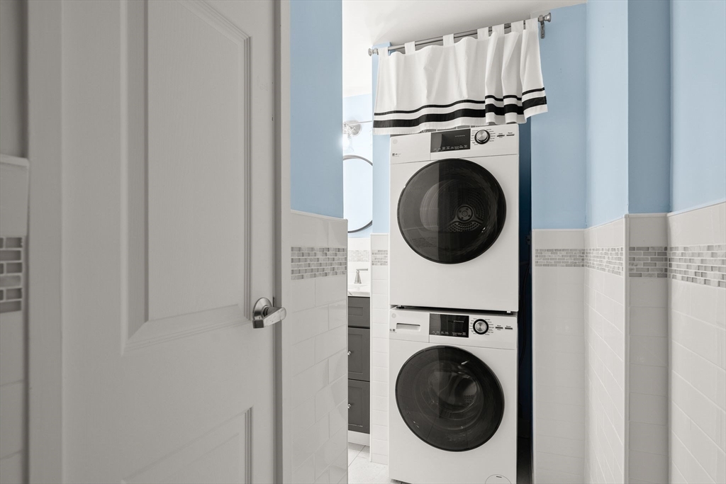 155 George Washington Boulevard, Unit 210 Hull, MA 02045 - Photo 21 of 42 a utility room with dryer and washer