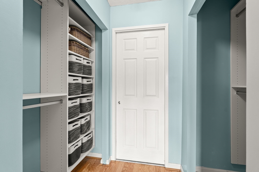155 George Washington Boulevard, Unit 210 Hull, MA 02045 - Photo 28 of 42 a view of closet area with empty racks