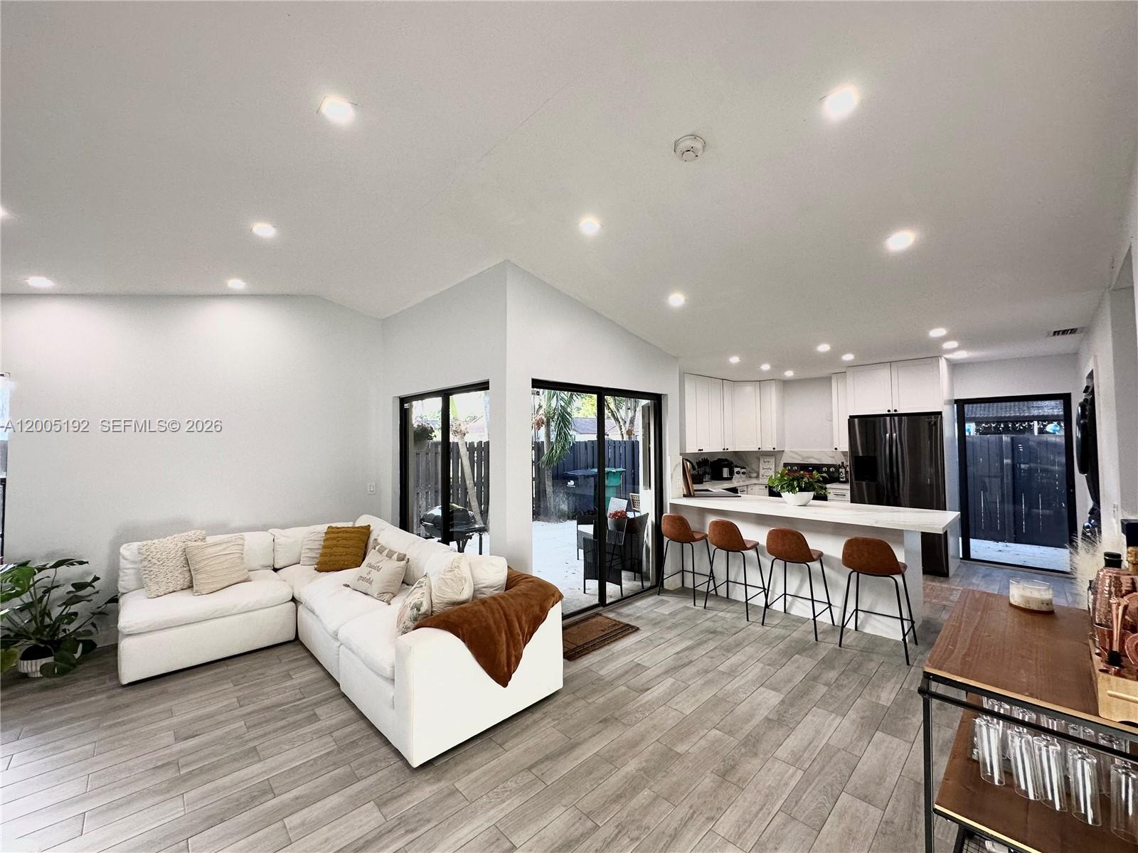 4840 Southwest 149th Court, Unit 16F Miami, FL 33185 - Photo 1 of 33 a living room with furniture and a table