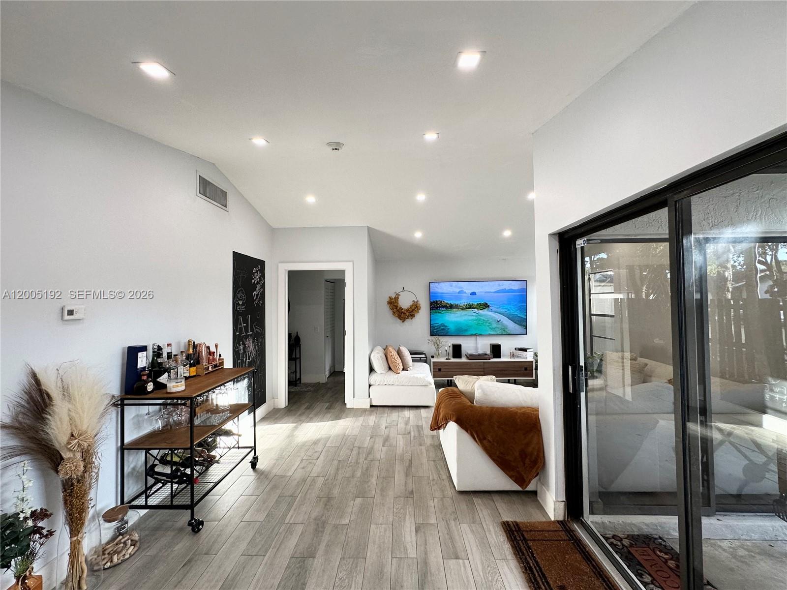 4840 Southwest 149th Court, Unit 16F Miami, FL 33185 - Photo 11 of 33 a living room with furniture and a flat screen tv