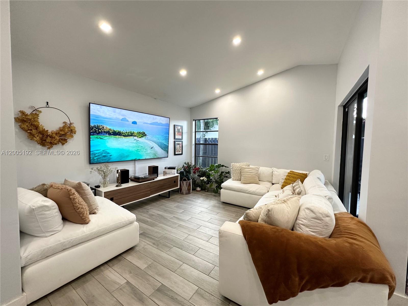 4840 Southwest 149th Court, Unit 16F Miami, FL 33185 - Photo 12 of 33 a living room with furniture and a flat screen tv