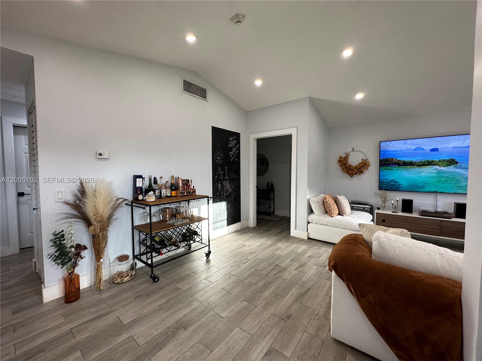 4840 Southwest 149th Court, Unit 16F Miami, FL 33185 - Photo 14 of 33 a living room with furniture and a flat screen tv