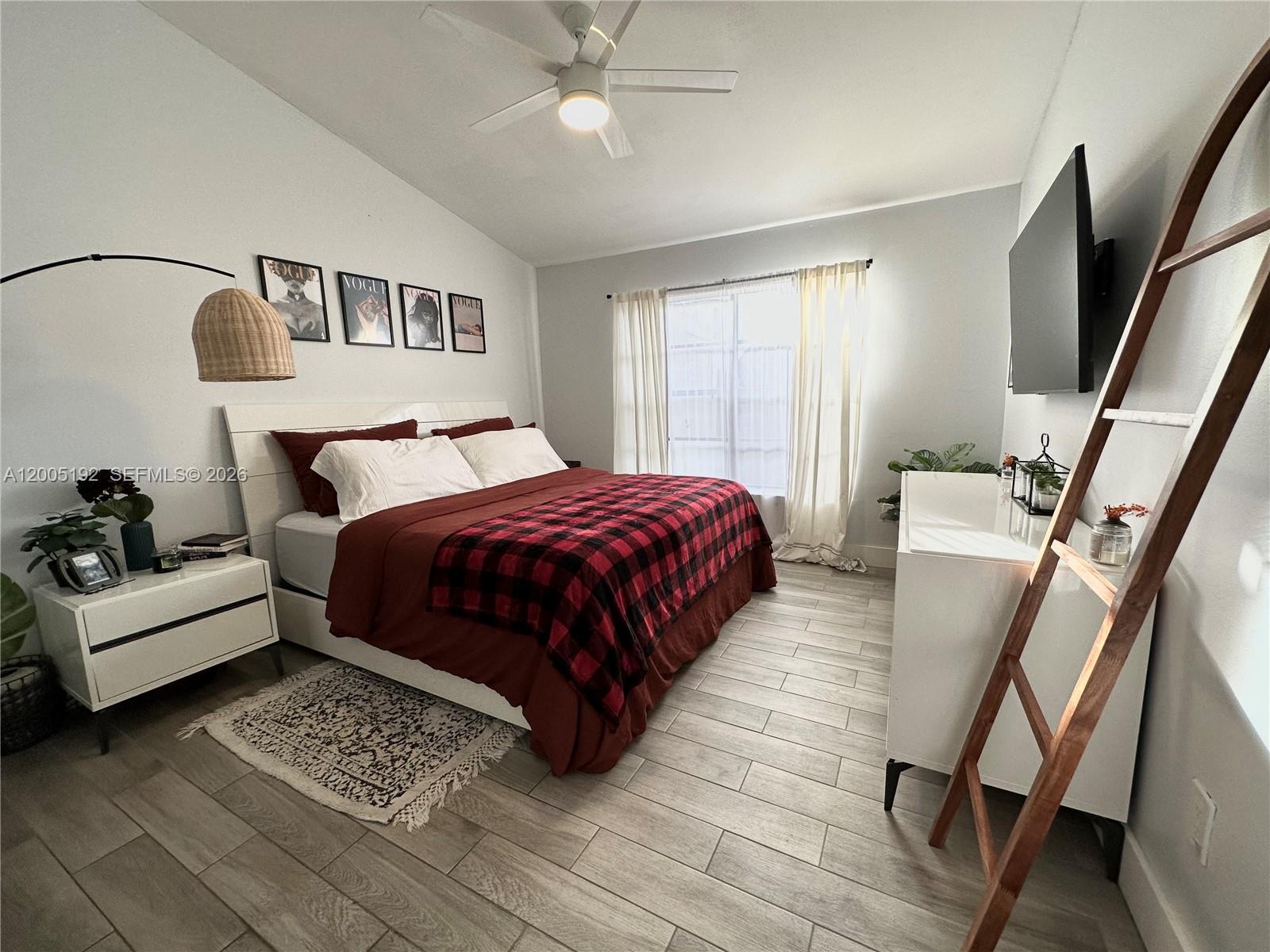 4840 Southwest 149th Court, Unit 16F Miami, FL 33185 - Photo 15 of 33 a bedroom with a bed couch and a window