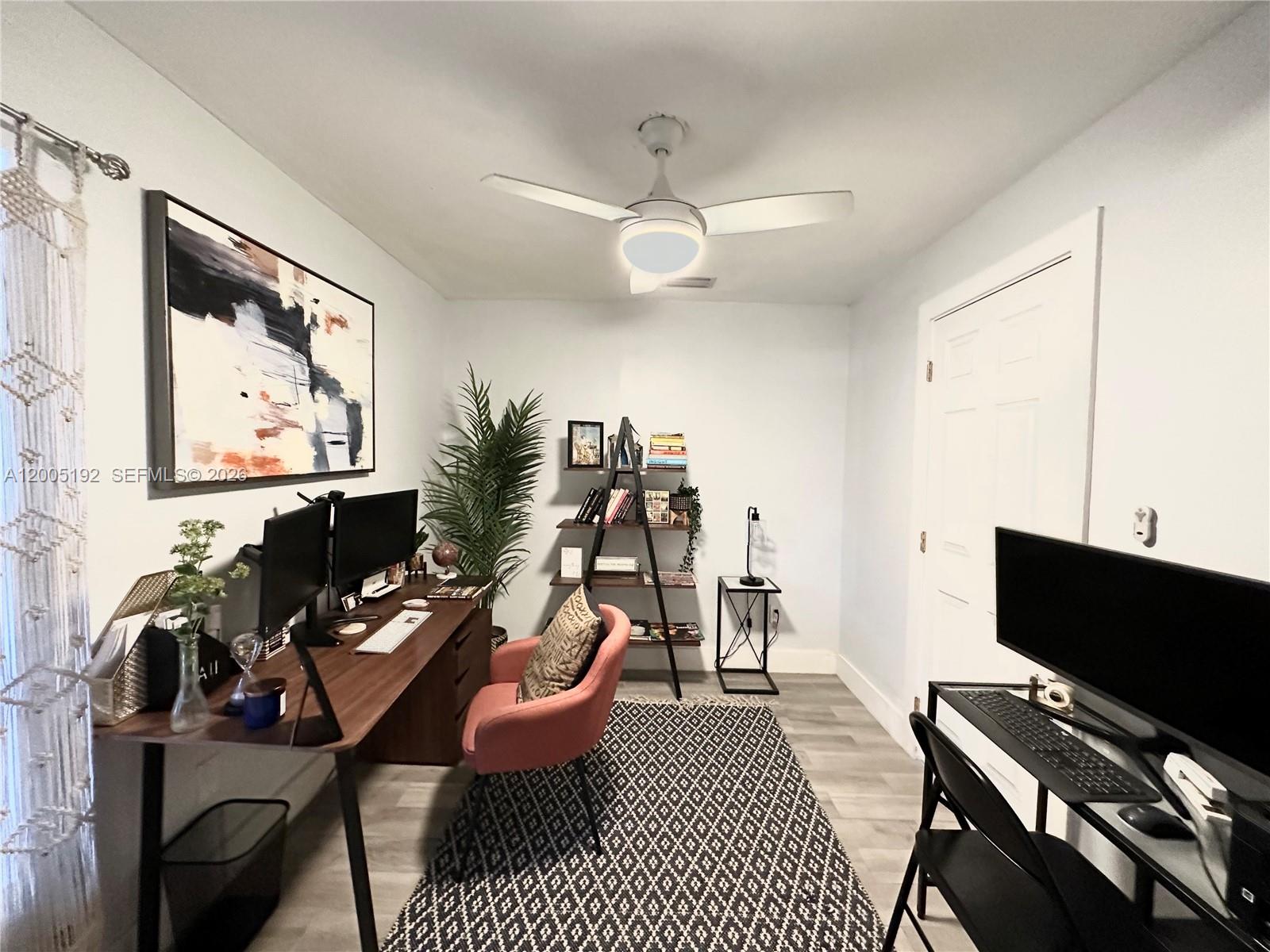 4840 Southwest 149th Court, Unit 16F Miami, FL 33185 - Photo 21 of 33 a living room with furniture a flat screen tv and a window