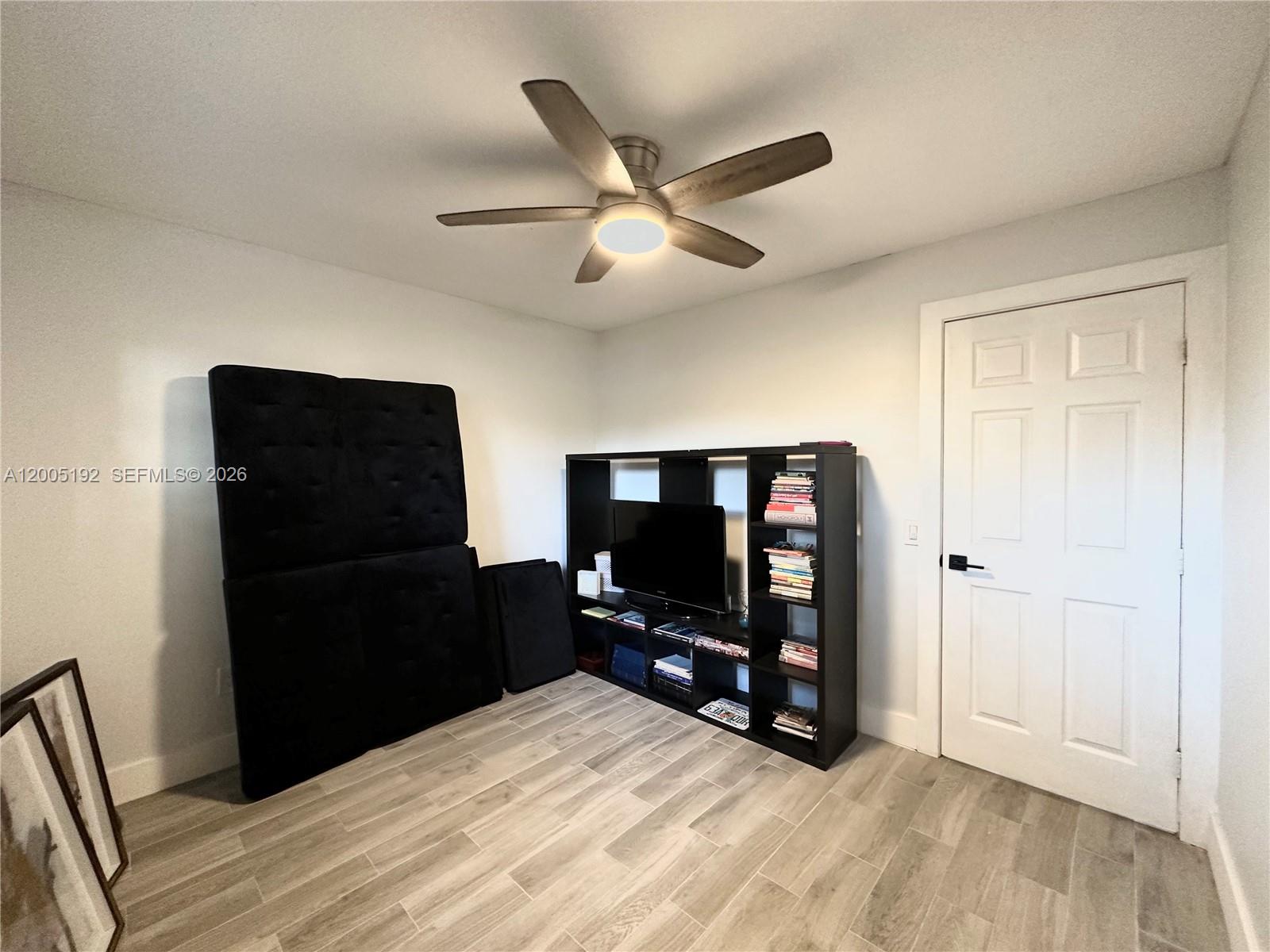 4840 Southwest 149th Court, Unit 16F Miami, FL 33185 - Photo 25 of 33 a bedroom with a bed and a television