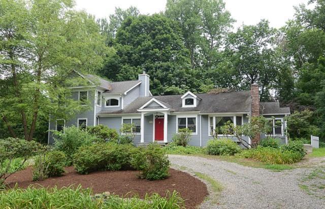 30 Nutmeg Court Ridgefield, CT 06877 - Photo 1 of 1 a front view of a residential houses with yard and green space