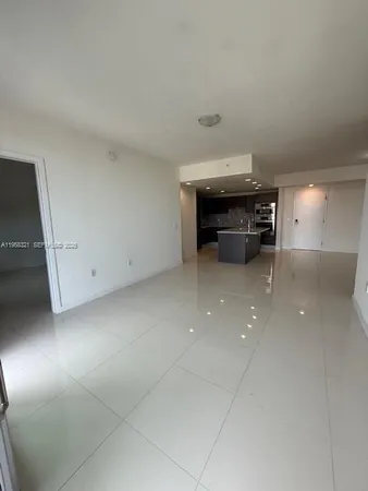 a view of kitchen with a sink and cabinets