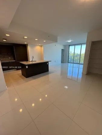 a view of a lobby with black carpet