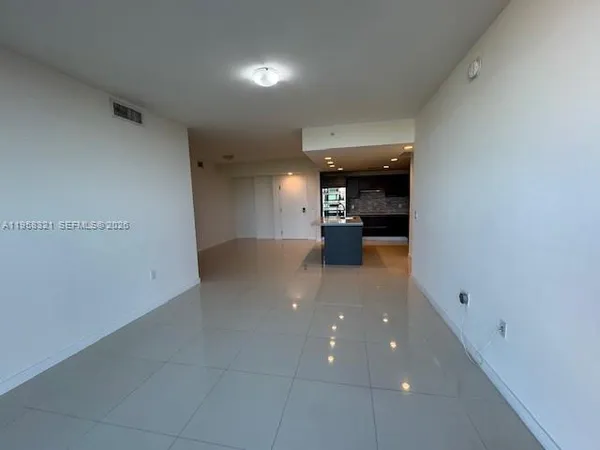 a view of a hallway with seating area