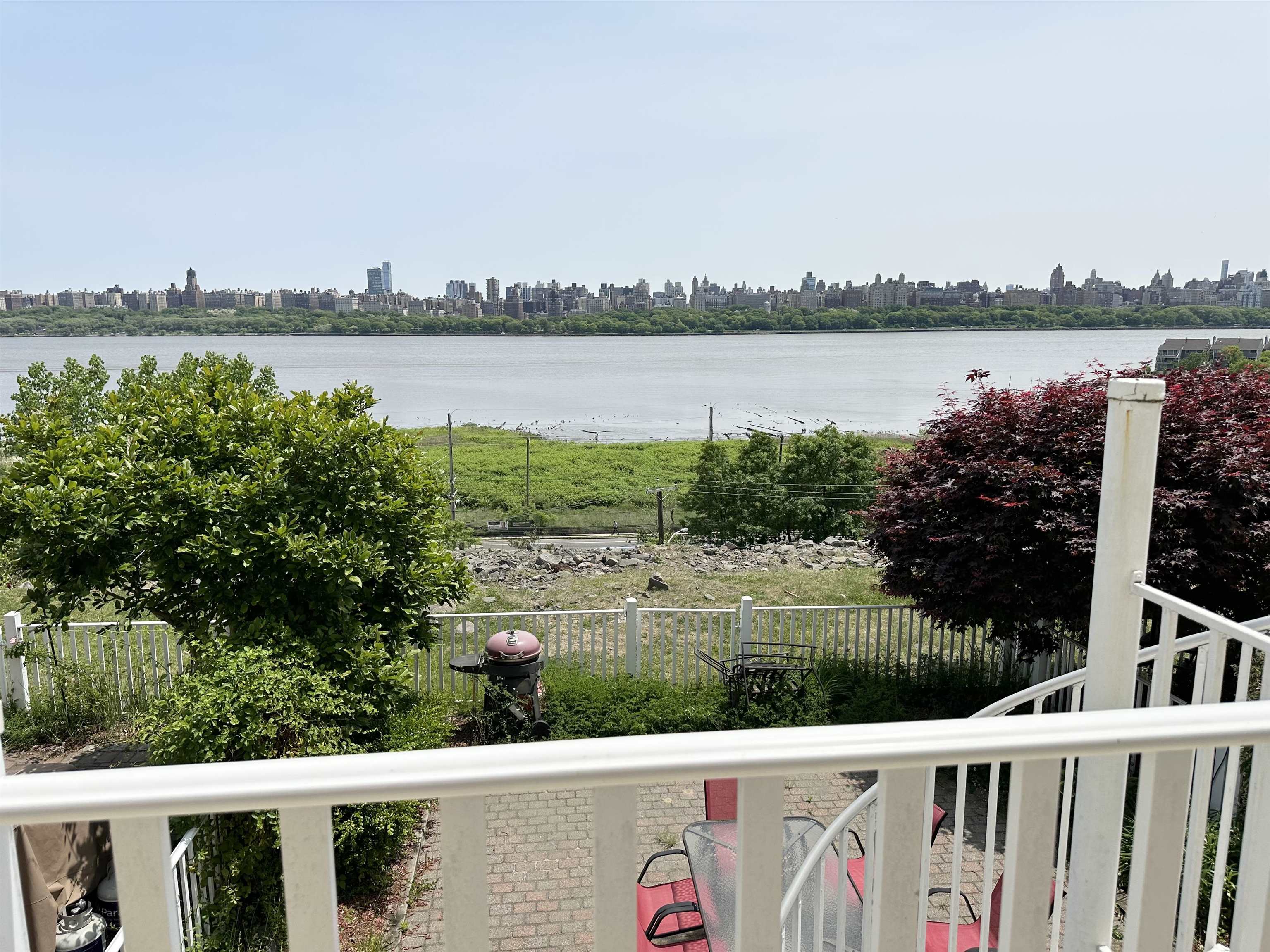 24 Bergen Ridge Road, Unit 1 North Bergen, NJ 07047 - Photo 2 of 17 a view of a lake with houses in the back