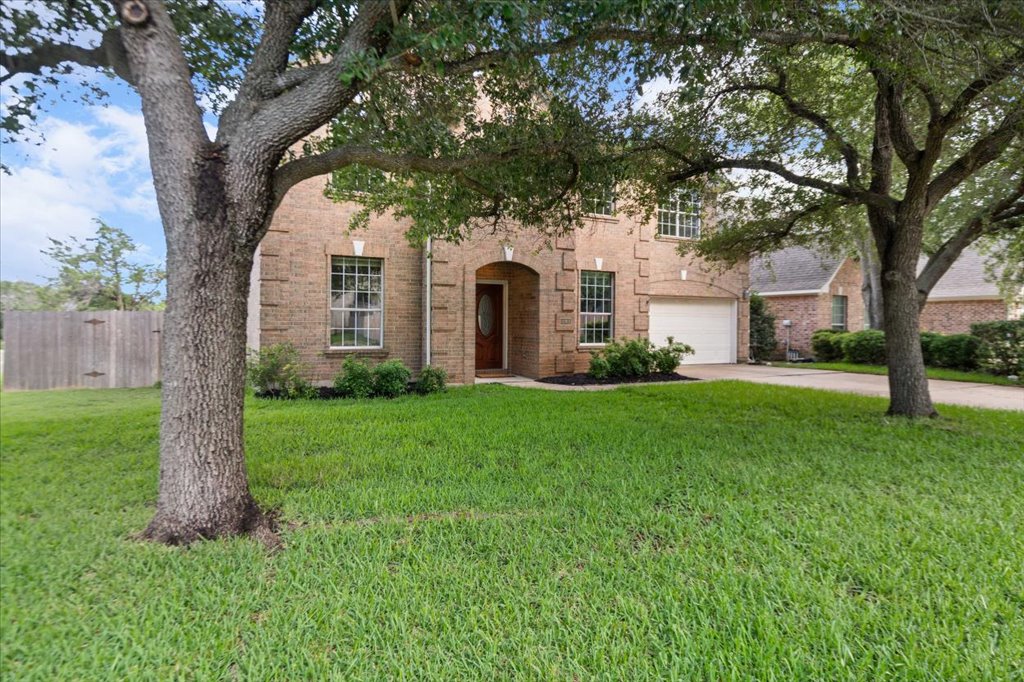 10801 Beachmont Lane Austin, TX 78739 - Photo 2 of 40 You'll love pulling onto your street to see your beautiful over-sized corner lot with lush green grass and tons of shade from the huge oak trees!