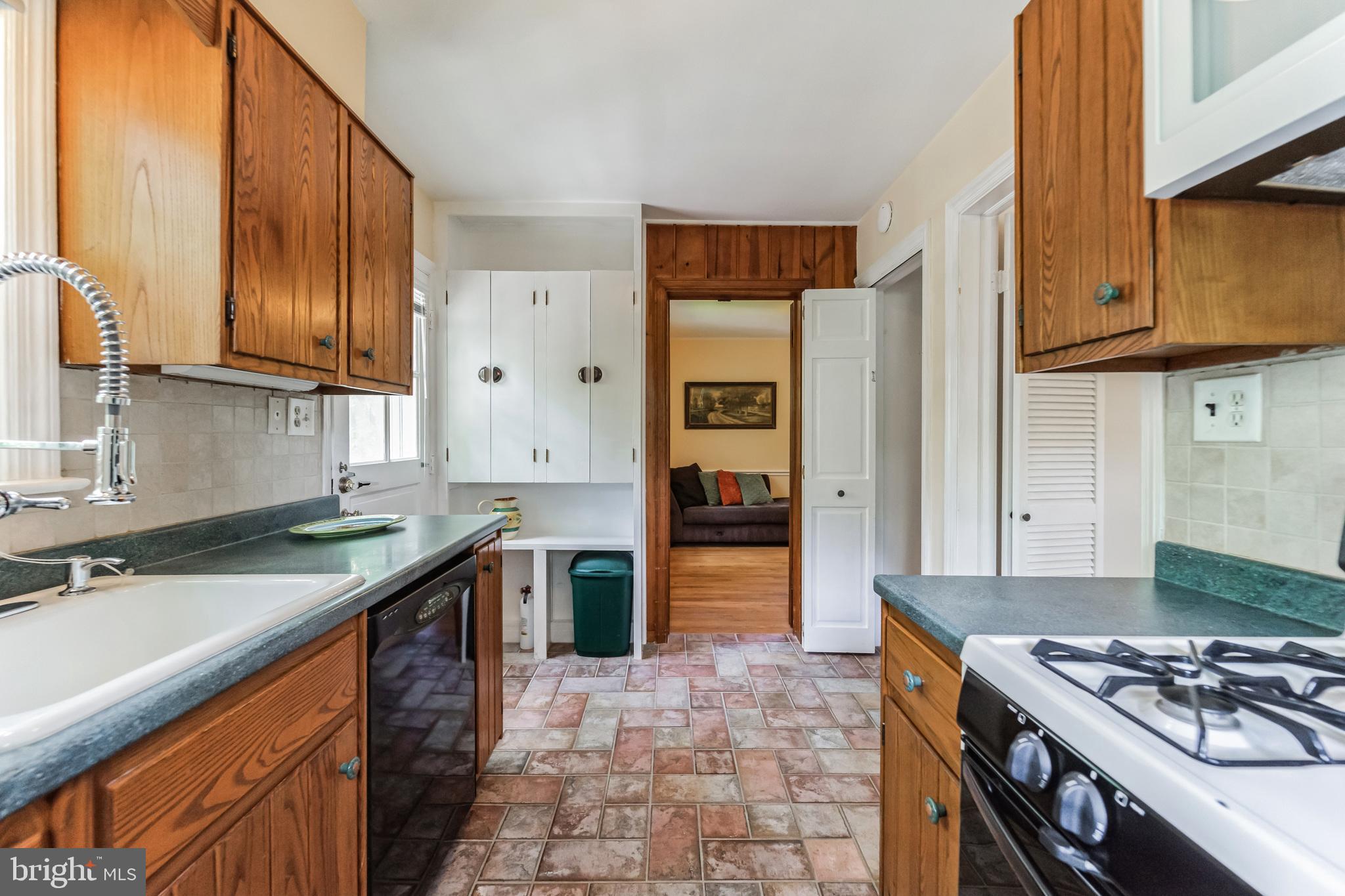 8907 Sudbury Road Silver Spring, MD 20901 - Photo 12 of 29 Galley kitchen with ceramic tile