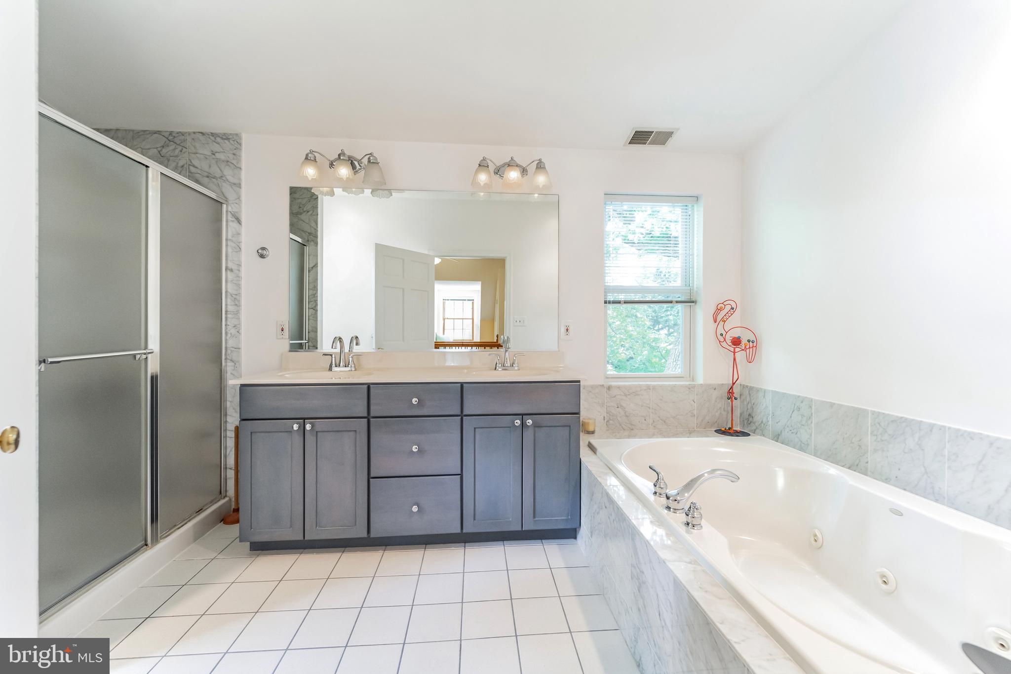 8907 Sudbury Road Silver Spring, MD 20901 - Photo 19 of 29 Primary bath with double vanity & separate shower