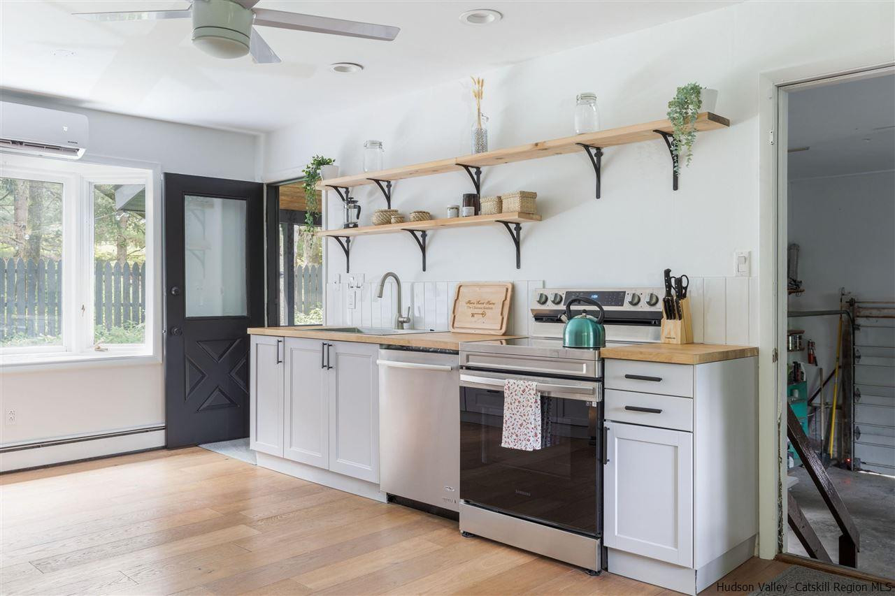 1882 County Road Olivebridge, NY 12461 - Photo 16 of 35 a kitchen with cabinets and stainless steel appliances