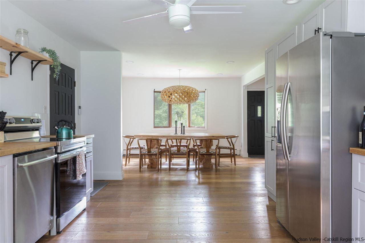 1882 County Road Olivebridge, NY 12461 - Photo 17 of 35 a view of a a dining room with furniture a chandelier and wooden floor