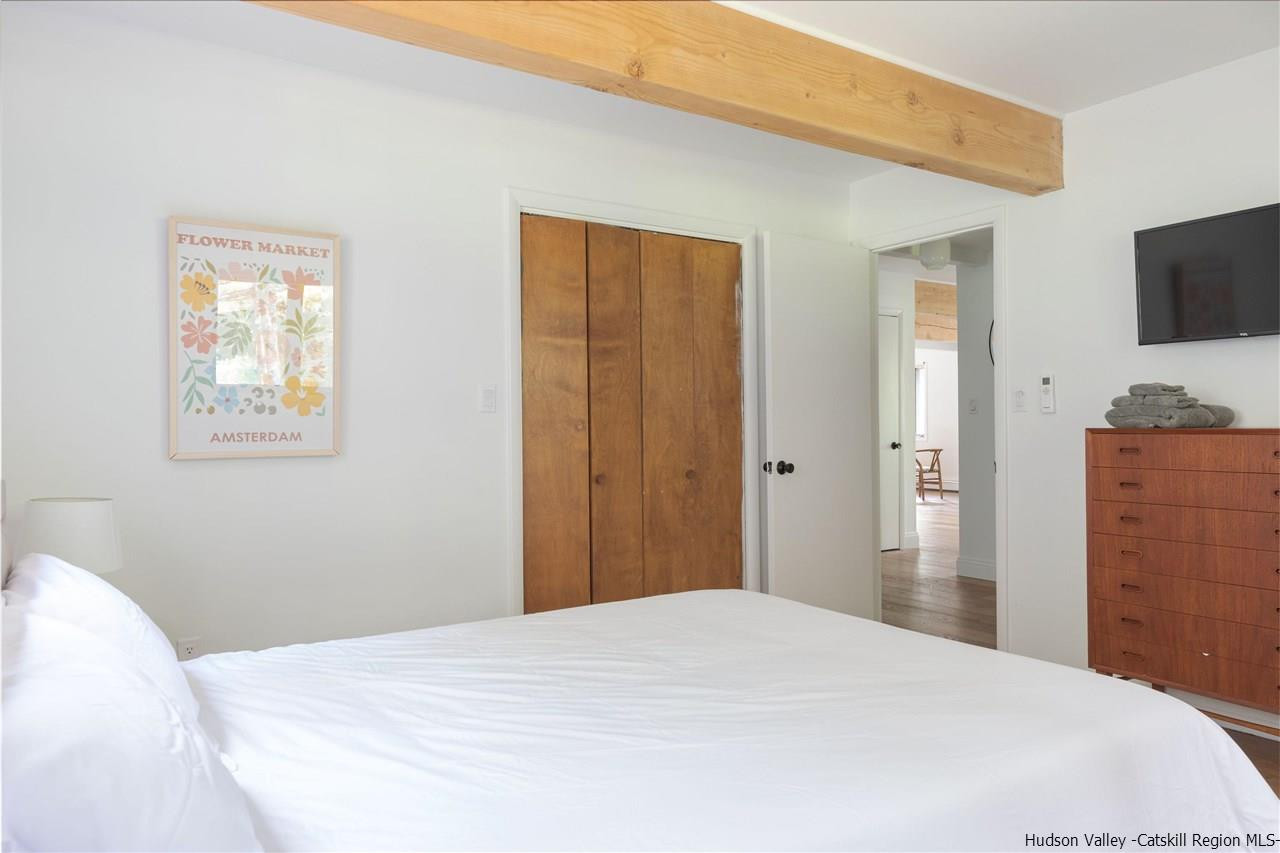 1882 County Road Olivebridge, NY 12461 - Photo 20 of 35 a bedroom with a bed and a flat screen tv