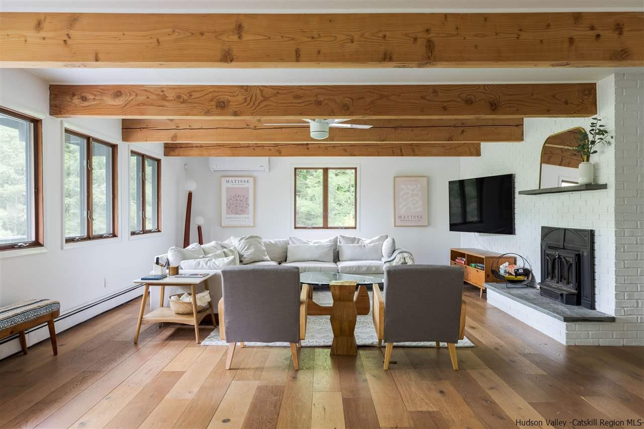 1882 County Road Olivebridge, NY 12461 - Photo 2 of 35 a living room with fireplace furniture and a flat screen tv