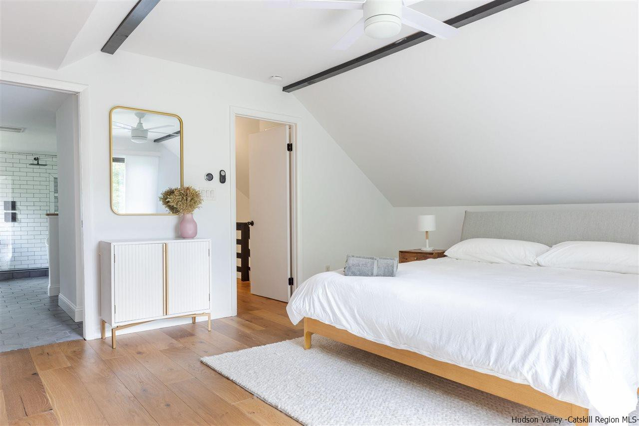 1882 County Road Olivebridge, NY 12461 - Photo 27 of 35 a bedroom with a bed and a wooden floor