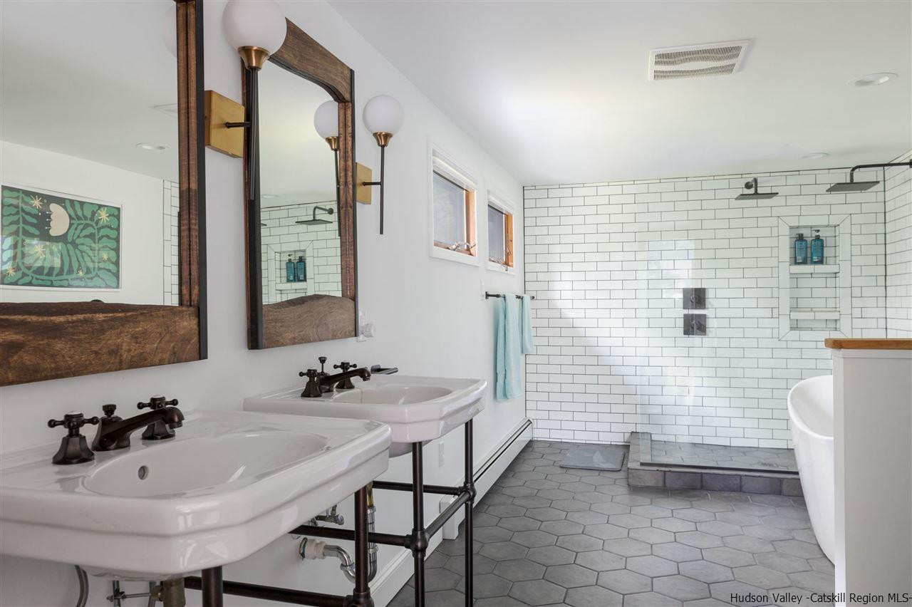 1882 County Road Olivebridge, NY 12461 - Photo 28 of 35 a bathroom with a sink a toilet and mirror
