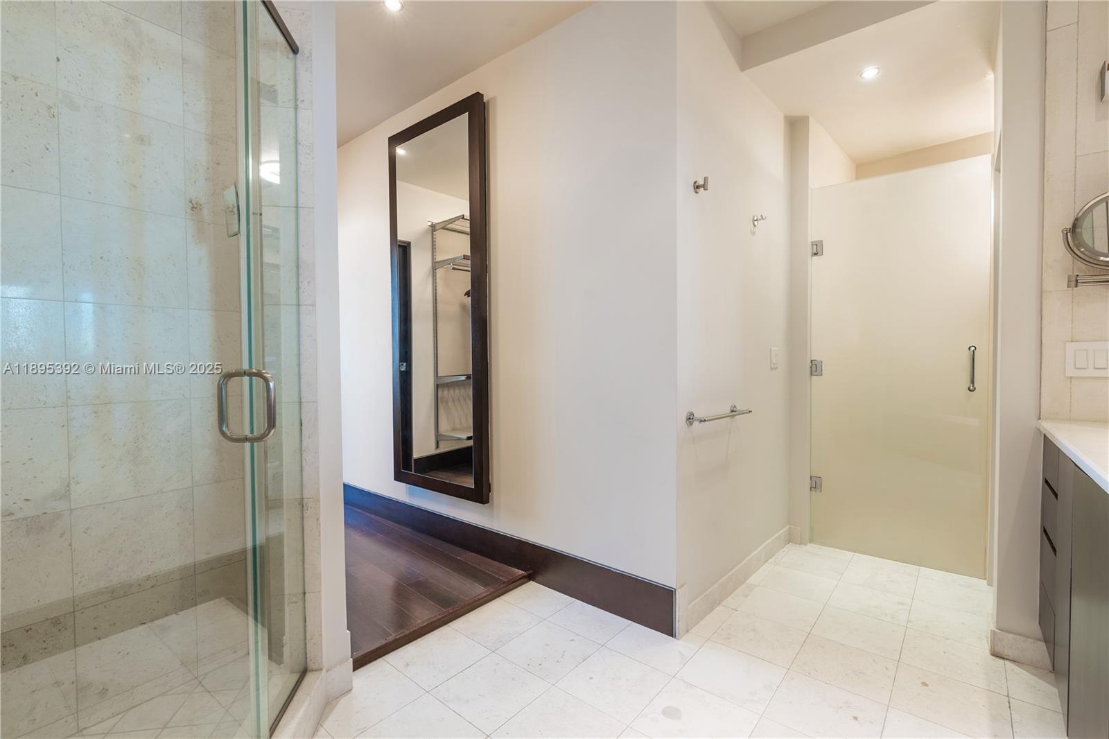 901 Brickell Key Boulevard, Unit 3607 Miami, FL 33131 - Photo 18 of 46 a bathroom with a shower and a sink