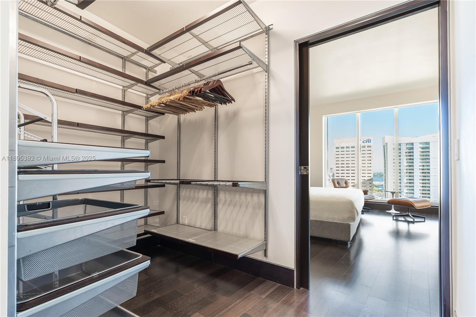901 Brickell Key Boulevard, Unit 3607 Miami, FL 33131 - Photo 20 of 46 a view of a livingroom with furniture and a ceiling fan