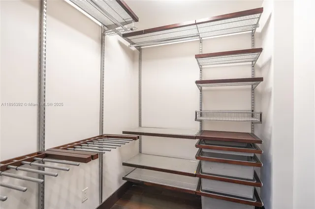 a kitchen with white cabinets and a stove