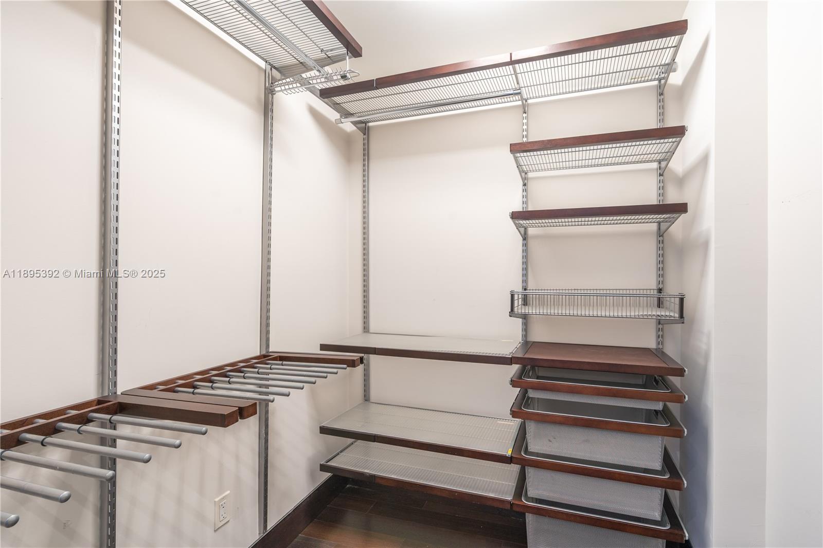 901 Brickell Key Boulevard, Unit 3607 Miami, FL 33131 - Photo 23 of 46 a kitchen with white cabinets and a stove