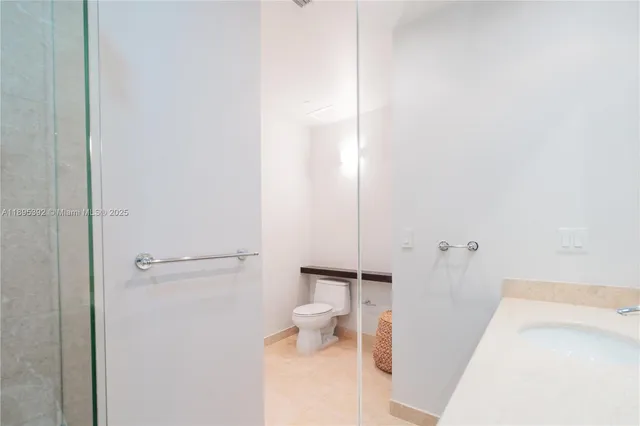a bathroom with a tub and a toilet