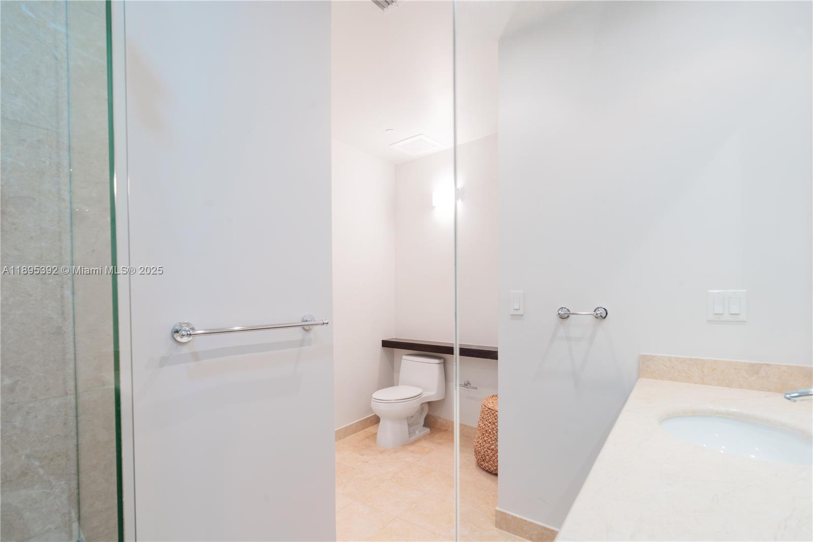 901 Brickell Key Boulevard, Unit 3607 Miami, FL 33131 - Photo 24 of 46 a bathroom with a tub and a toilet