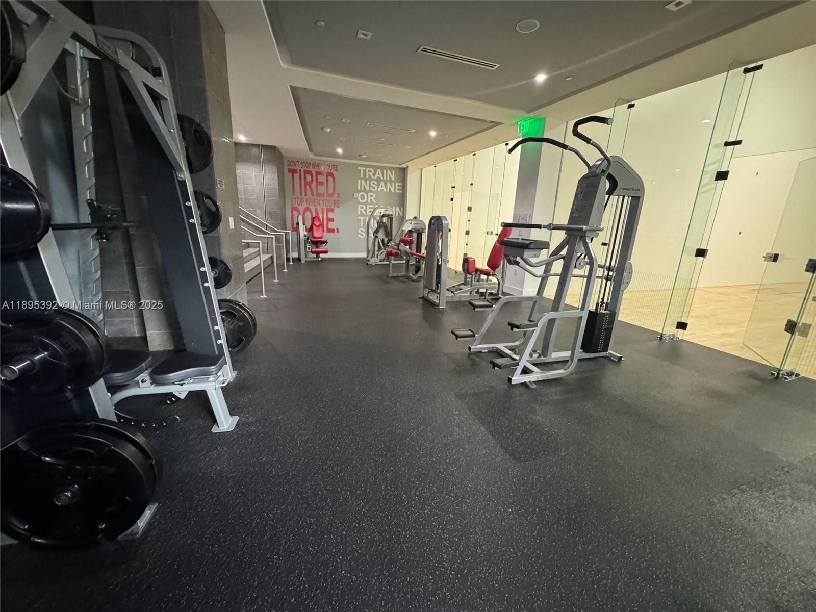 901 Brickell Key Boulevard, Unit 3607 Miami, FL 33131 - Photo 36 of 46 a view of a room with gym equipment