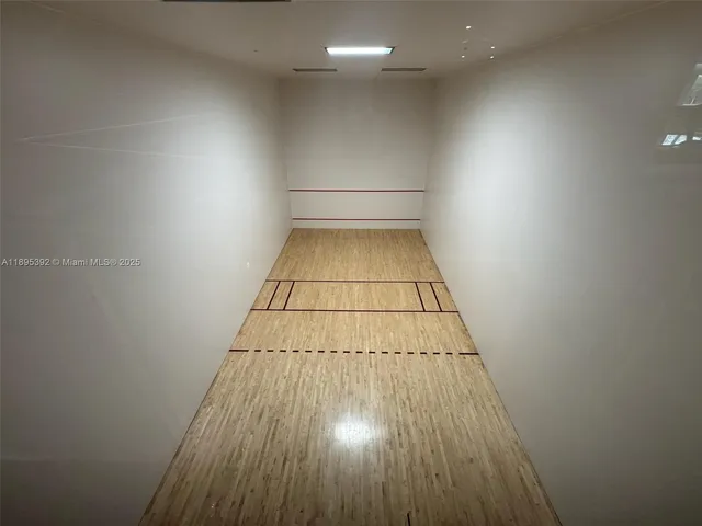 an entryway of a house with wooden floor