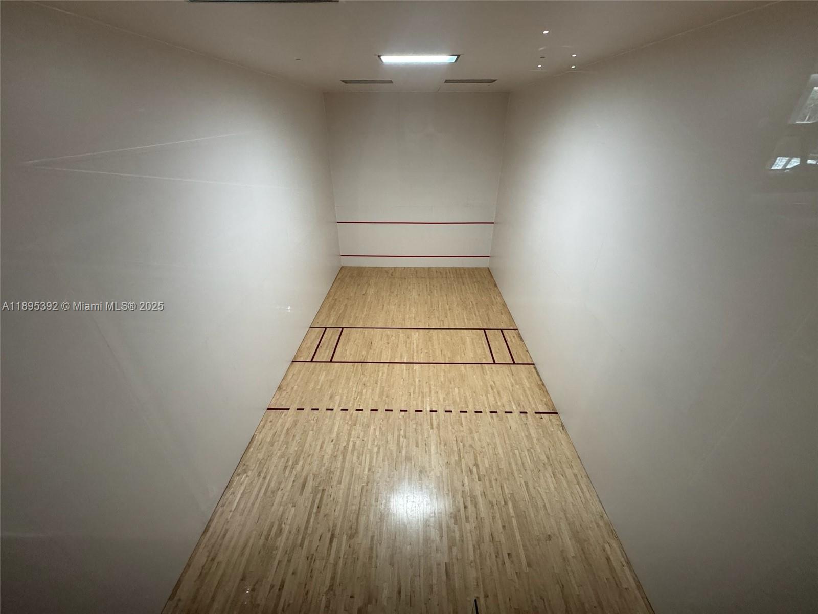 901 Brickell Key Boulevard, Unit 3607 Miami, FL 33131 - Photo 37 of 46 an entryway of a house with wooden floor