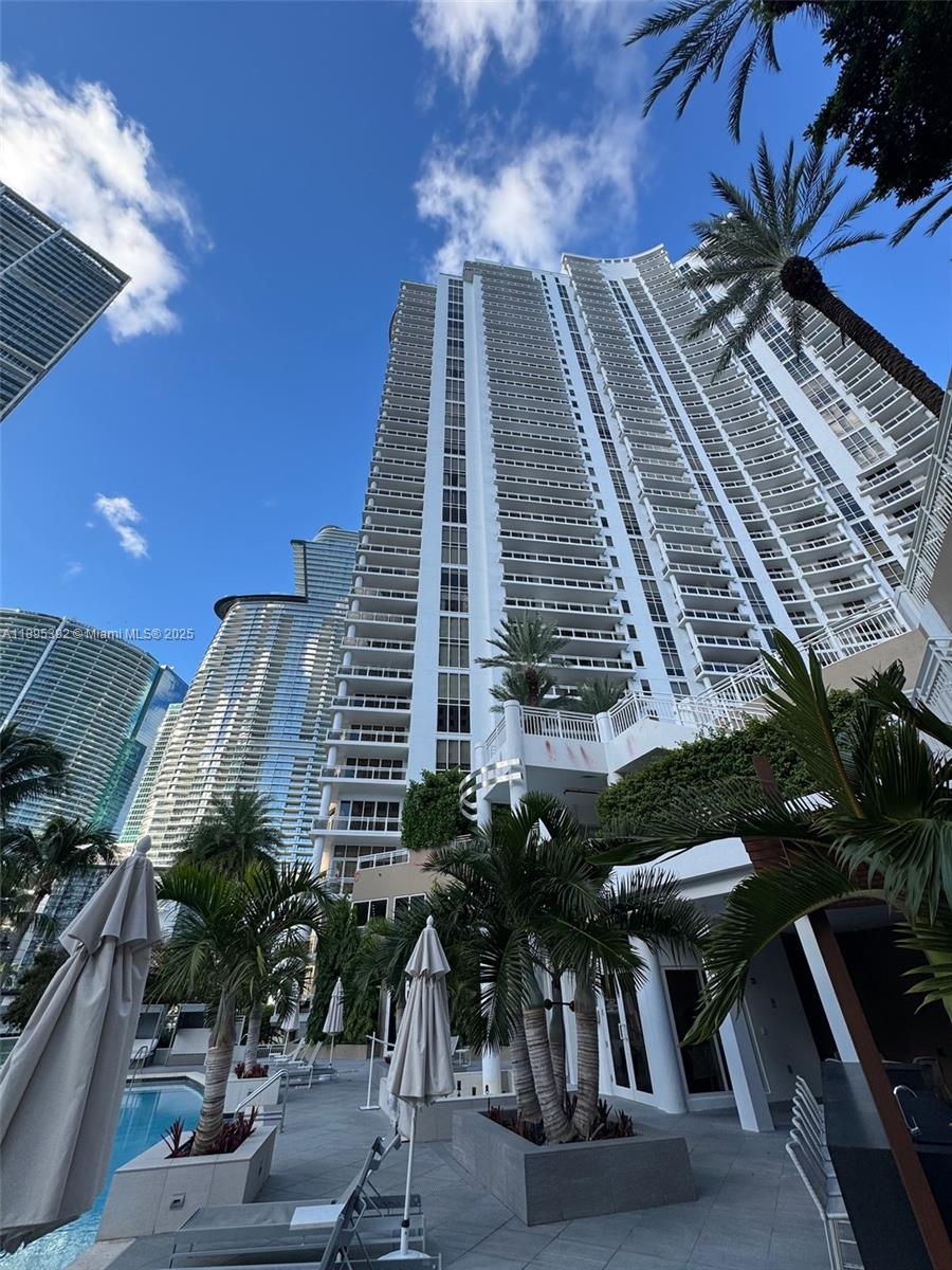901 Brickell Key Boulevard, Unit 3607 Miami, FL 33131 - Photo 44 of 46 a picture of a building with a yard