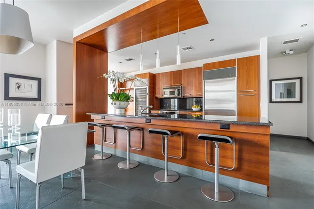 a kitchen with a sink cabinets and window